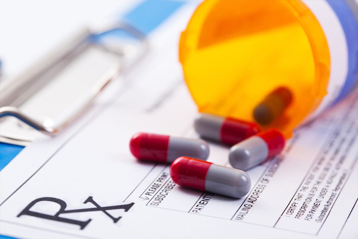 A close up of pills on top of a table